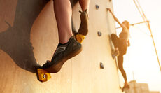 bigstock-Bottom-View-Of-Two-Young-Climb-232470481